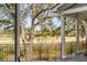 Scenic view of the golf course from the porch with a large tree at 1429 Burningtree Rd, Charleston, SC 29412