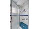 Shower stall with blue accent tiles and etched glass shower door at 1429 Burningtree Rd, Charleston, SC 29412