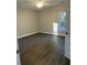 Spacious bedroom featuring sleek, dark floors, a ceiling fan, and a bright window for natural light at 149 Rose Ave, Walterboro, SC 29488
