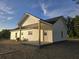Side view of the home, featuring vinyl siding, a covered porch, and a well-maintained exterior at 149 Rose Ave, Walterboro, SC 29488