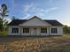 Charming single-story home boasts a classic design with symmetrical windows and a welcoming front porch at 149 Rose Ave, Walterboro, SC 29488
