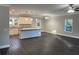 Open-concept living space featuring modern lighting, hardwood floors, and a kitchen with a center island at 149 Rose Ave, Walterboro, SC 29488