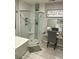 Modern bathroom featuring a large shower with glass doors and a vanity area with a framed mirror at 1545 Ashley River Rd # 3K, Charleston, SC 29407