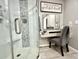 Bathroom features walk-in shower and vanity area with chair at 1545 Ashley River Rd # 3K, Charleston, SC 29407