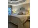 Relaxing bedroom features soft lighting, a decorative mirror, and a comfortable bed with plush pillows at 1545 Ashley River Rd # 3K, Charleston, SC 29407