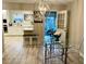 Bright dining area features a glass table and a view of a sunny outdoor patio at 1545 Ashley River Rd # 3K, Charleston, SC 29407