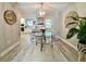 Dining area with clear chairs, modern light fixture, and access to kitchen at 1545 Ashley River Rd # 3K, Charleston, SC 29407