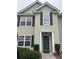 Charming front entrance featuring a dark green door with sidelights, complemented by manicured landscaping for added curb appeal at 1545 Ashley River Rd # 3K, Charleston, SC 29407