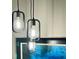 Modern pendant lighting fixtures illuminate the room, creating a contemporary ambiance at 1545 Ashley River Rd # 3K, Charleston, SC 29407