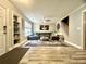 Living room with an entry door, a gray sectional sofa, ceiling fan, and stylish decor at 1545 Ashley River Rd # 3K, Charleston, SC 29407