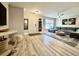 Inviting living room with wood floors, a comfortable sectional sofa, and stylish decor at 1545 Ashley River Rd # 3K, Charleston, SC 29407