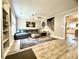 A large living room with a modern sectional sofa, ceiling fan, and stylish decor at 1545 Ashley River Rd # 3K, Charleston, SC 29407