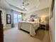 Main bedroom featuring carpeted floors, a ceiling fan, and plenty of natural light at 1545 Ashley River Rd # 3K, Charleston, SC 29407