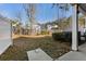 View of the backyard with a wood fence and minimal landscaping in a community of blue homes at 1549 Moss Spring Rd, Mount Pleasant, SC 29466