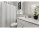 This bathroom features a white vanity, toilet, and shower with stylish decor at 1549 Moss Spring Rd, Mount Pleasant, SC 29466