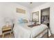Bright bedroom featuring a closet, side table, star pillows and bronze bed frame at 1549 Moss Spring Rd, Mount Pleasant, SC 29466
