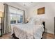 Well-lit bedroom featuring a full-sized bed, neutral colors, and contemporary art at 1549 Moss Spring Rd, Mount Pleasant, SC 29466