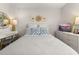 Cozy bedroom featuring a white bed, a TV on a dresser, soft lighting, and decorative wall accents at 1549 Moss Spring Rd, Mount Pleasant, SC 29466