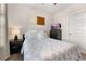 Tastefully decorated bedroom features a full-sized bed, side table, and contemporary art at 1549 Moss Spring Rd, Mount Pleasant, SC 29466