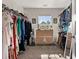 Spacious walk-in closet with built-in shelving and natural light streaming through a window at 1549 Moss Spring Rd, Mount Pleasant, SC 29466