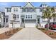 Charming multi-level townhome with attached garages and well-manicured landscaping at 1549 Moss Spring Rd, Mount Pleasant, SC 29466