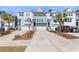 Attractive townhomes with attached garages, driveways and green space at 1549 Moss Spring Rd, Mount Pleasant, SC 29466