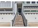 Inviting entryway with brick steps, white railings and a decorative wreath at 1549 Moss Spring Rd, Mount Pleasant, SC 29466
