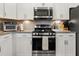 Modern kitchen range with stainless steel appliances and granite countertops at 1549 Moss Spring Rd, Mount Pleasant, SC 29466
