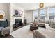 Inviting living room with a fireplace, sofa, and large windows offering natural light at 1549 Moss Spring Rd, Mount Pleasant, SC 29466