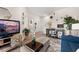 Open-concept living area with modern decor, a TV, and adjacent desk space at 1549 Moss Spring Rd, Mount Pleasant, SC 29466