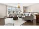 Cozy living room featuring a large sectional sofa and large windows at 1549 Moss Spring Rd, Mount Pleasant, SC 29466