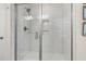 Modern glass shower with white subway tile, built-in niche, and chrome fixtures, showcasing clean design at 1549 Moss Spring Rd, Mount Pleasant, SC 29466