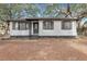 Charming home featuring freshly painted exterior, manicured lawn, and updated shutters at 1652 Larry St, North Charleston, SC 29405