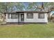 Charming home featuring freshly painted exterior, manicured lawn, and updated shutters at 1652 Larry St, North Charleston, SC 29405
