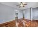 A living room with hardwood floors, gray walls, and a ceiling fan is perfect for entertaining guests at 1652 Larry St, North Charleston, SC 29405