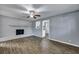 Open living room with fireplace, ceiling fan, and hardwood floors at 1652 Larry St, North Charleston, SC 29405