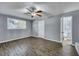 Main bedroom with wood-look flooring, a ceiling fan, and an ensuite bathroom at 1652 Larry St, North Charleston, SC 29405