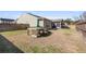 A spacious backyard featuring green grass, patio furniture, and a well-maintained lawn at 1855 Halle Rd, Johns Island, SC 29455