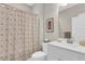 Bathroom featuring a patterned shower curtain, framed artwork, and a white sink and vanity at 1855 Halle Rd, Johns Island, SC 29455