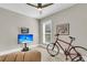 Bright bedroom with a large window, TV, artwork, and bicycle for active living at 1855 Halle Rd, Johns Island, SC 29455