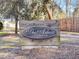 Community sign reading The Arbors in St. Johns Woods with mature trees and landscaping at 1855 Halle Rd, Johns Island, SC 29455