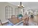 Formal dining room adjacent to the kitchen features hardwood floors and decorative wall features at 1855 Halle Rd, Johns Island, SC 29455