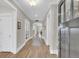 Inviting foyer with hardwood floors, neutral walls, and a view into the open-concept living spaces at 1855 Halle Rd, Johns Island, SC 29455
