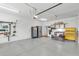 Clean garage with overhead door, storage cabinets, and organized tools at 1855 Halle Rd, Johns Island, SC 29455
