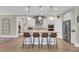 Modern kitchen featuring white cabinetry, a granite island with seating, and stainless steel appliances at 1855 Halle Rd, Johns Island, SC 29455