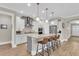 Bright kitchen with white cabinets, stainless appliances, granite counters, and a large island with seating at 1855 Halle Rd, Johns Island, SC 29455