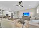 Open-concept living room featuring wood floors, a ceiling fan, and a kitchen with stainless steel appliances at 1855 Halle Rd, Johns Island, SC 29455