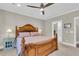 The main bedroom features a wooden bed frame and a doorway leading to the bathroom at 1855 Halle Rd, Johns Island, SC 29455