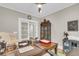 Office featuring a large desk, chair, cabinets, and sliding doors at 1855 Halle Rd, Johns Island, SC 29455