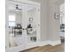 Office featuring glass french doors, desk, chair, and view to a living area at 1855 Halle Rd, Johns Island, SC 29455